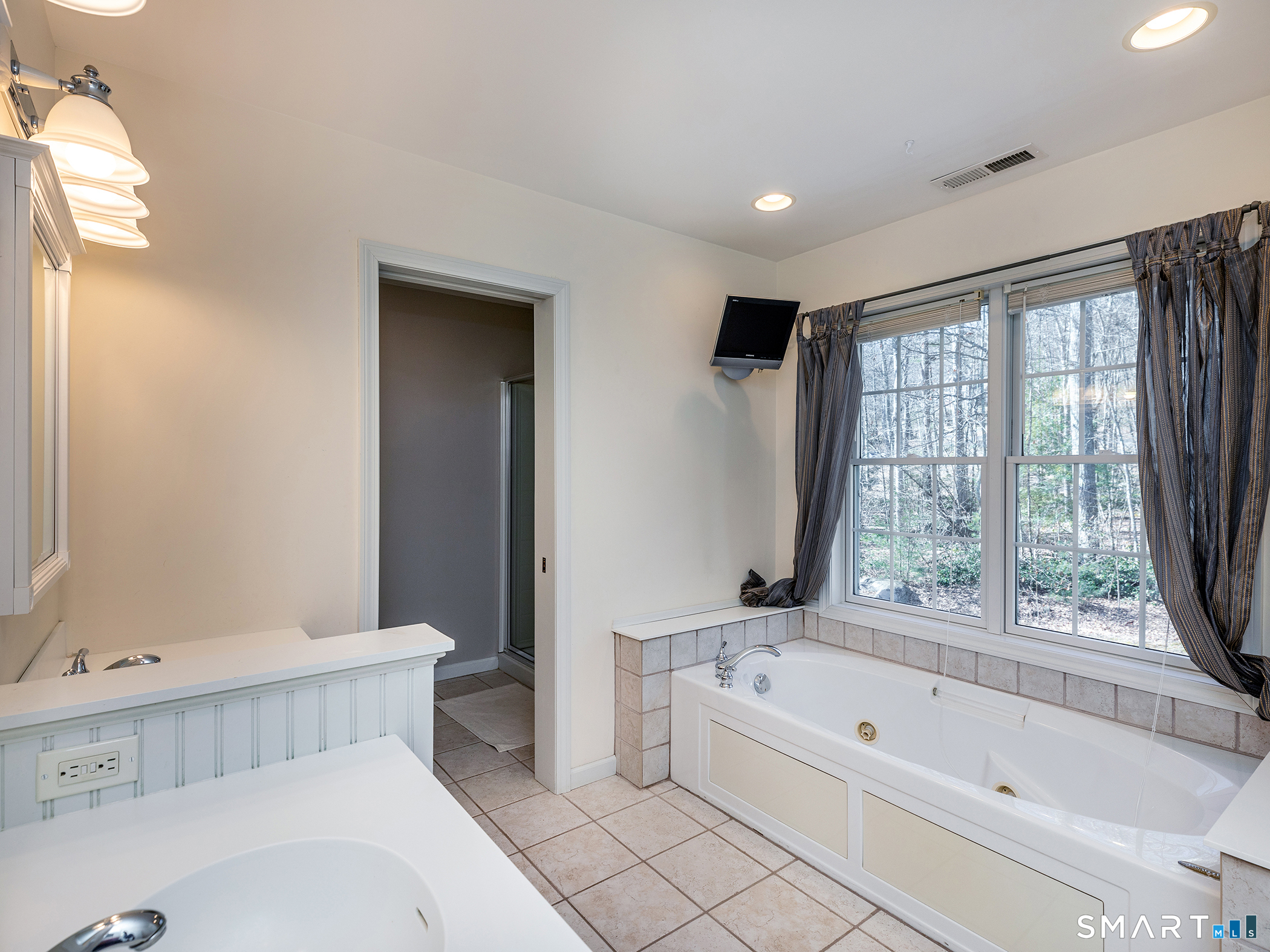 3 Weldon Court Goshen, CT 06756 - Photo 24 of 38 a bathroom with a bathtub a toilet and a sink