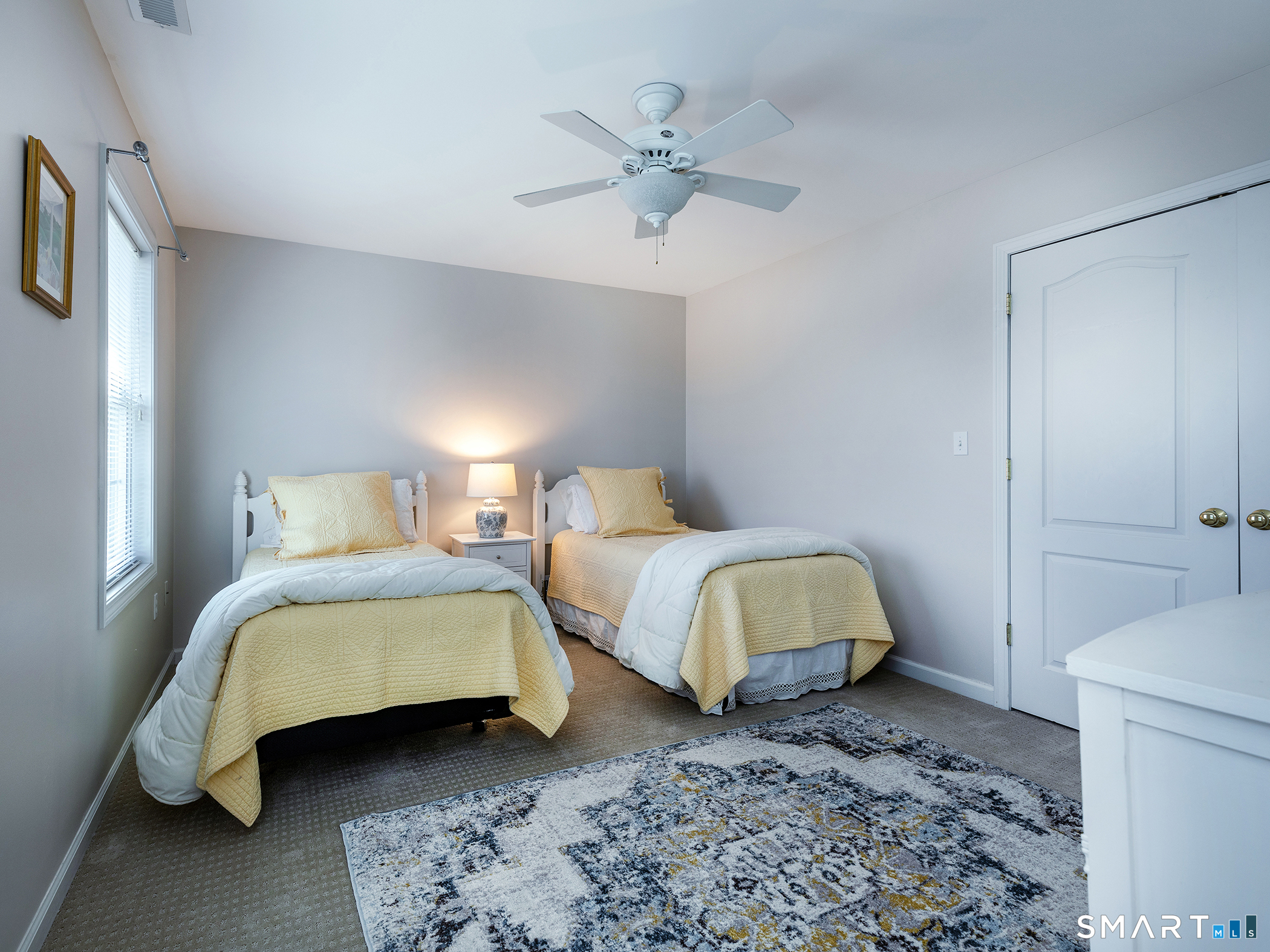 3 Weldon Court Goshen, CT 06756 - Photo 28 of 38 a bedroom with a bed and a lamp