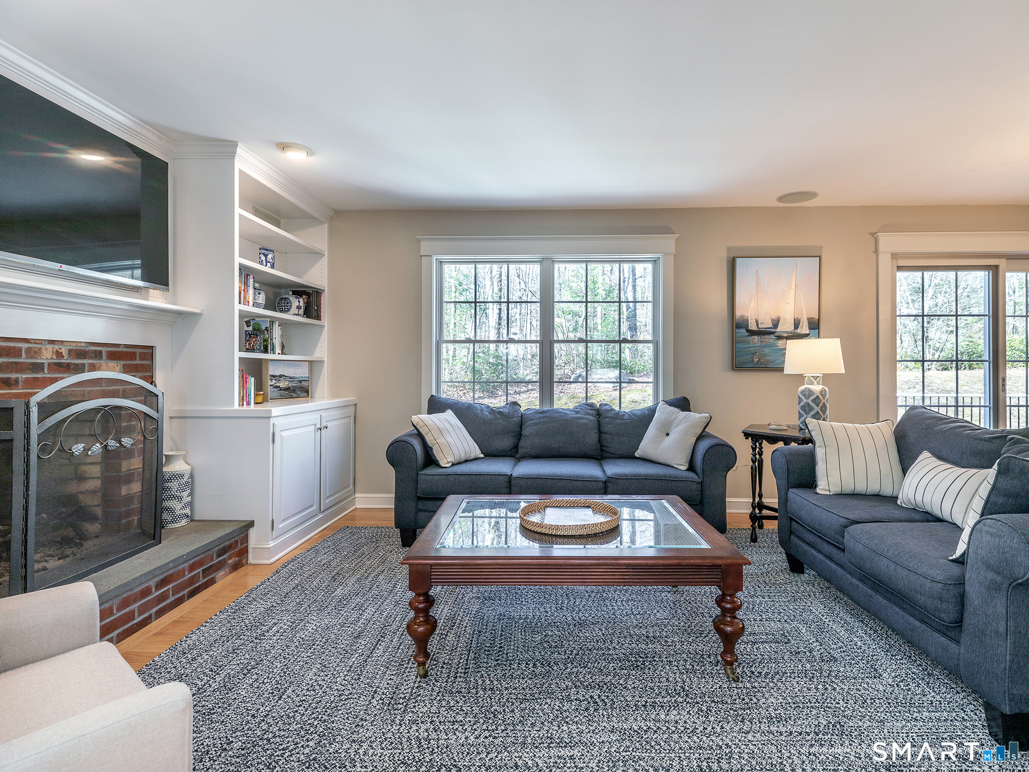 3 Weldon Court Goshen, CT 06756 - Photo 10 of 38 a living room with furniture a flat screen tv and a fireplace