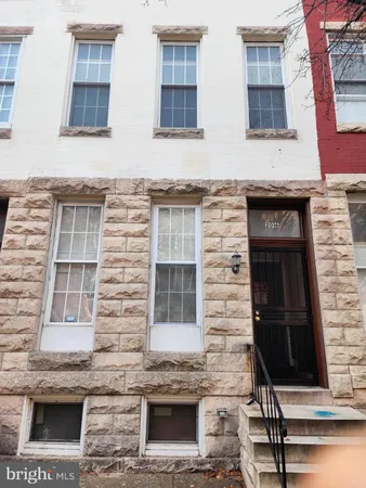 a brick building with four windows