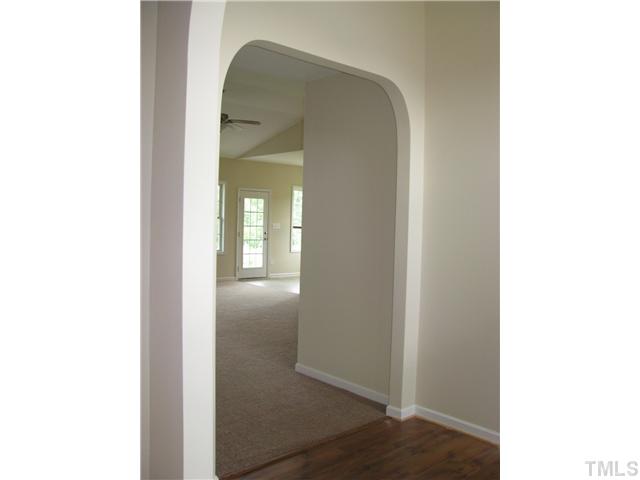 6328 Slopeside Court Raleigh, NC 27610 - Photo 4 of 18 Large Open Foyer with Hardwoods and Arched Openings