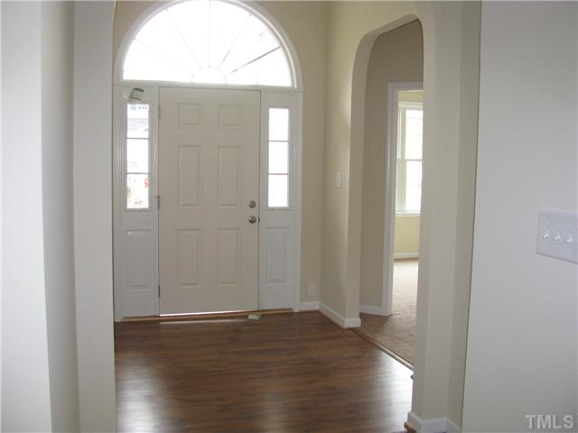 6328 Slopeside Court Raleigh, NC 27610 - Photo 5 of 18 Large Open Foyer with Hardwoods, Arched Openings and plenty of light