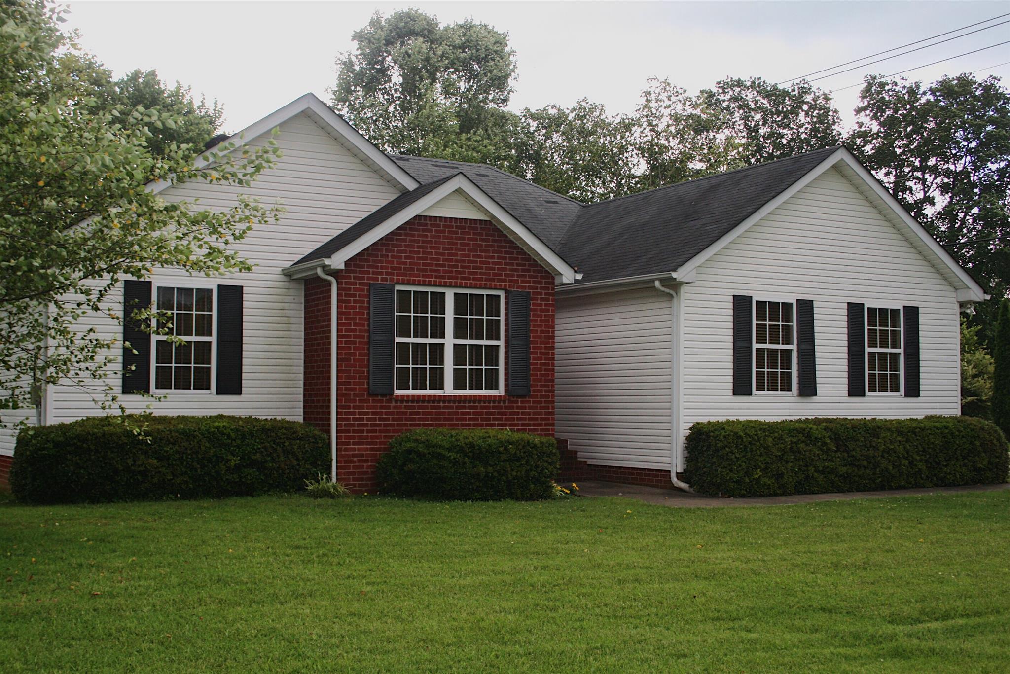 729 Crescent Road Murfreesboro, TN 37128 - Photo 1 of 15 a front view of a house with a garden