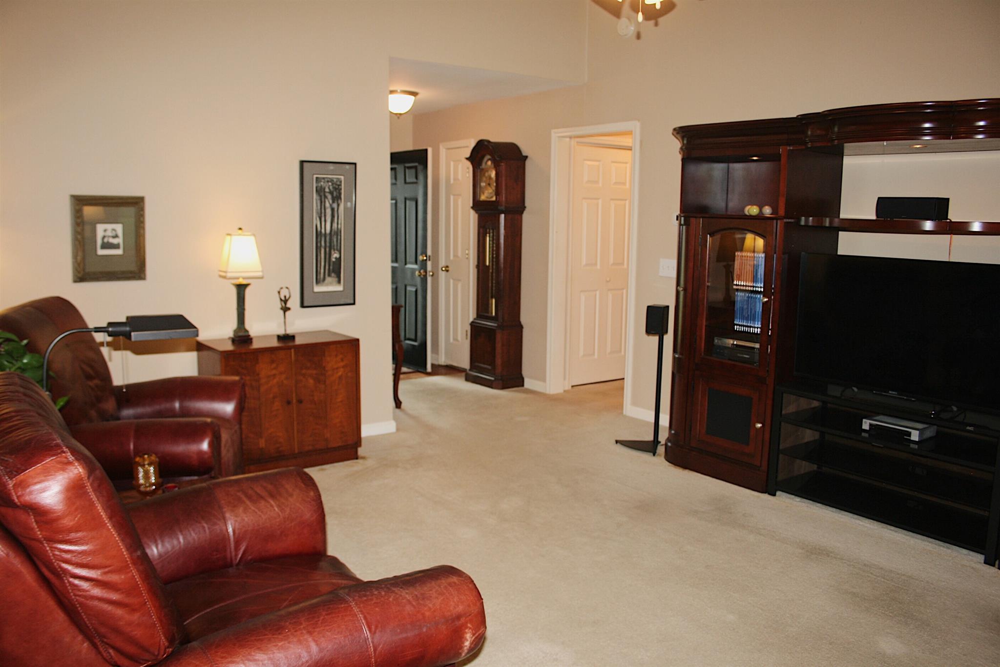 729 Crescent Road Murfreesboro, TN 37128 - Photo 3 of 15 a living room with furniture a ceiling fan and a flat screen tv