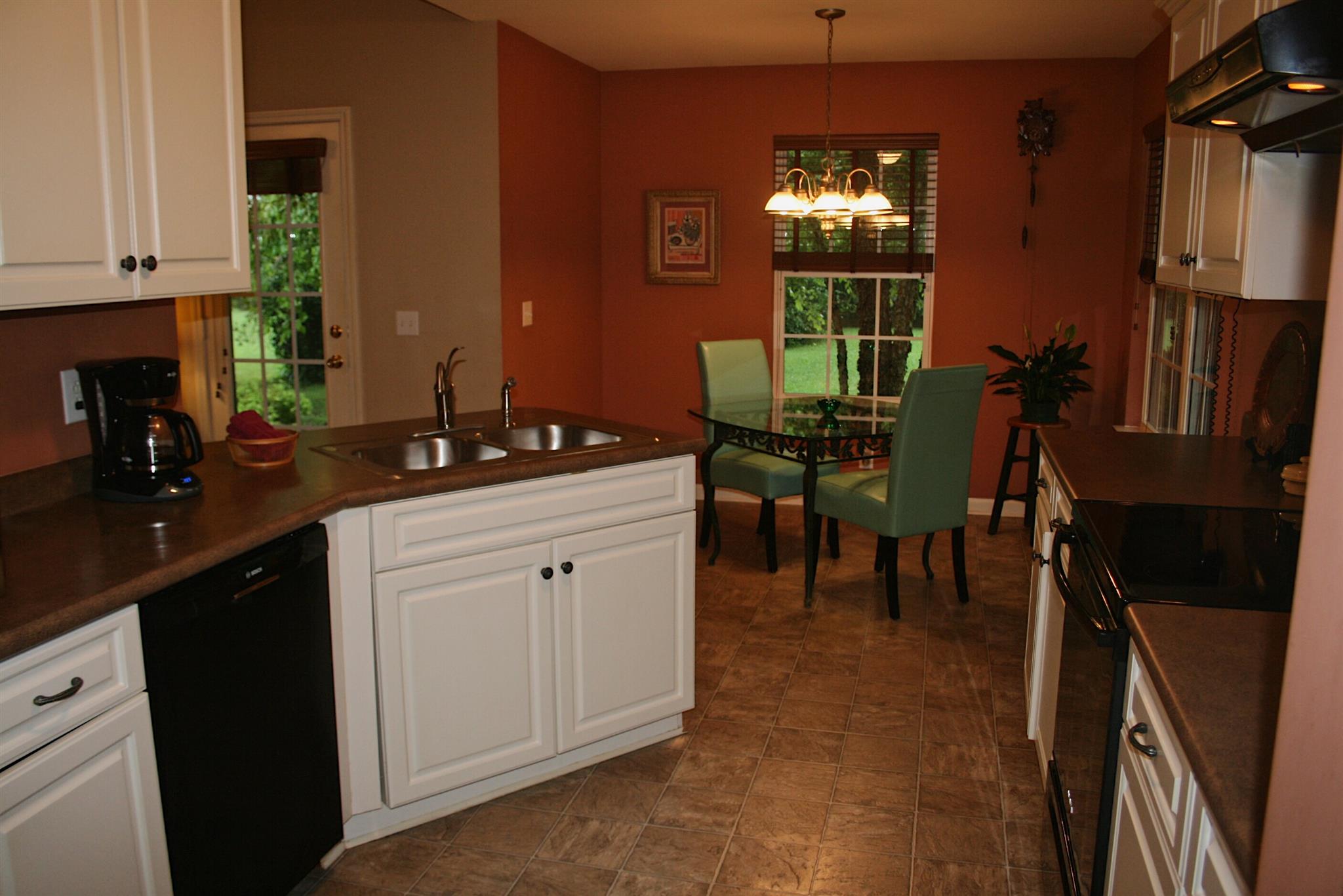 729 Crescent Road Murfreesboro, TN 37128 - Photo 5 of 15 a kitchen with granite countertop sink window and cabinets