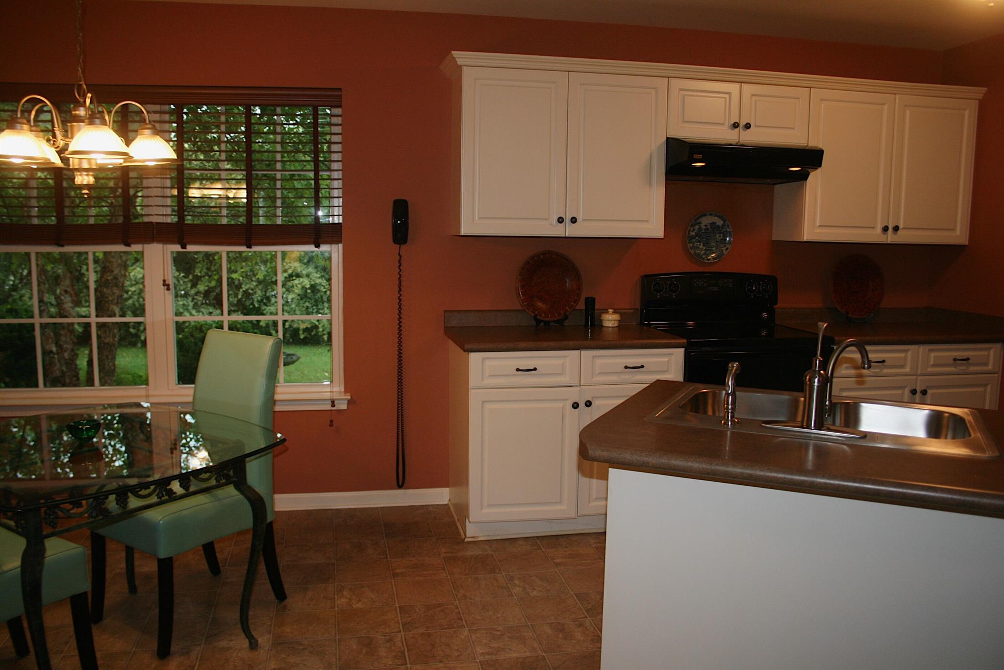 729 Crescent Road Murfreesboro, TN 37128 - Photo 6 of 15 a kitchen with stainless steel appliances granite countertop a stove a sink and a microwave