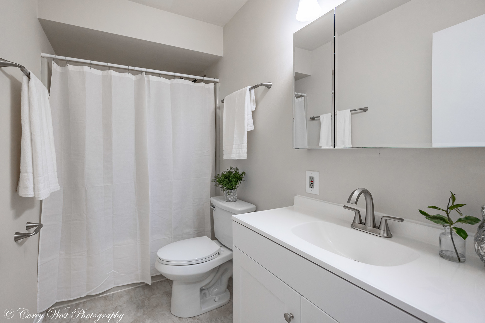 202 Chamberlain Drive DeKalb, IL 60115 - Photo 16 of 28 a bathroom with a sink a toilet and shower