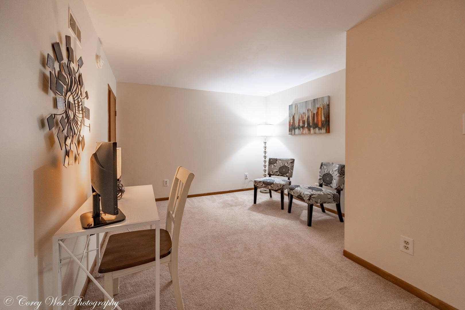 202 Chamberlain Drive DeKalb, IL 60115 - Photo 19 of 28 a living room with furniture and a table