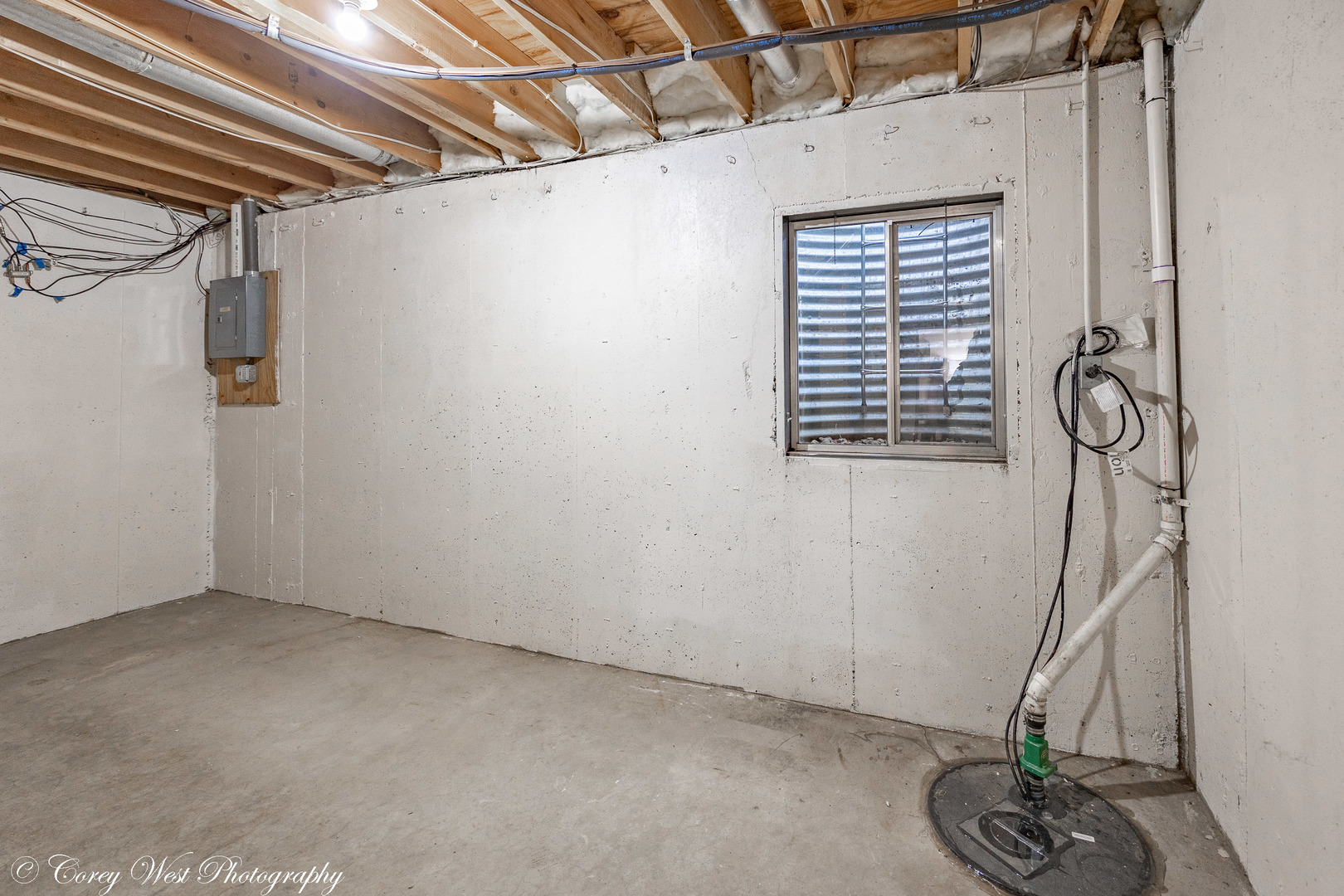 202 Chamberlain Drive DeKalb, IL 60115 - Photo 24 of 28 a view of a room with rack and stairs