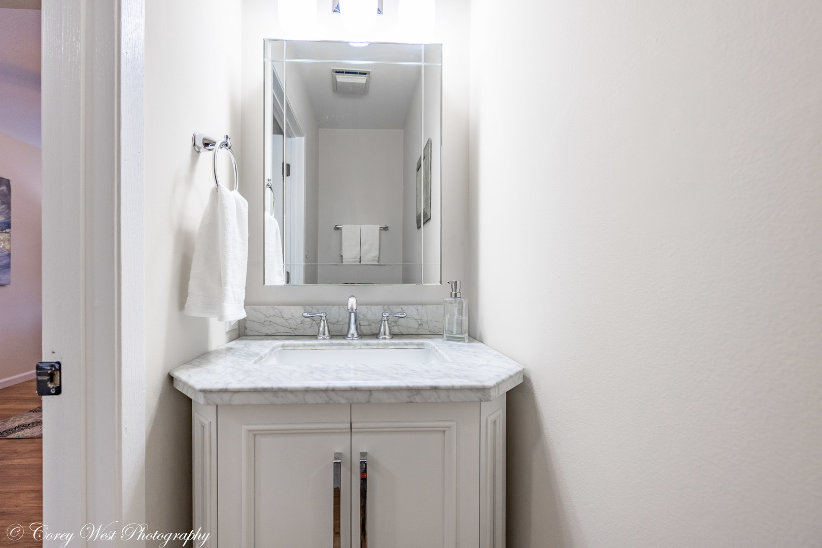 202 Chamberlain Drive DeKalb, IL 60115 - Photo 8 of 28 a bathroom with a sink and a mirror