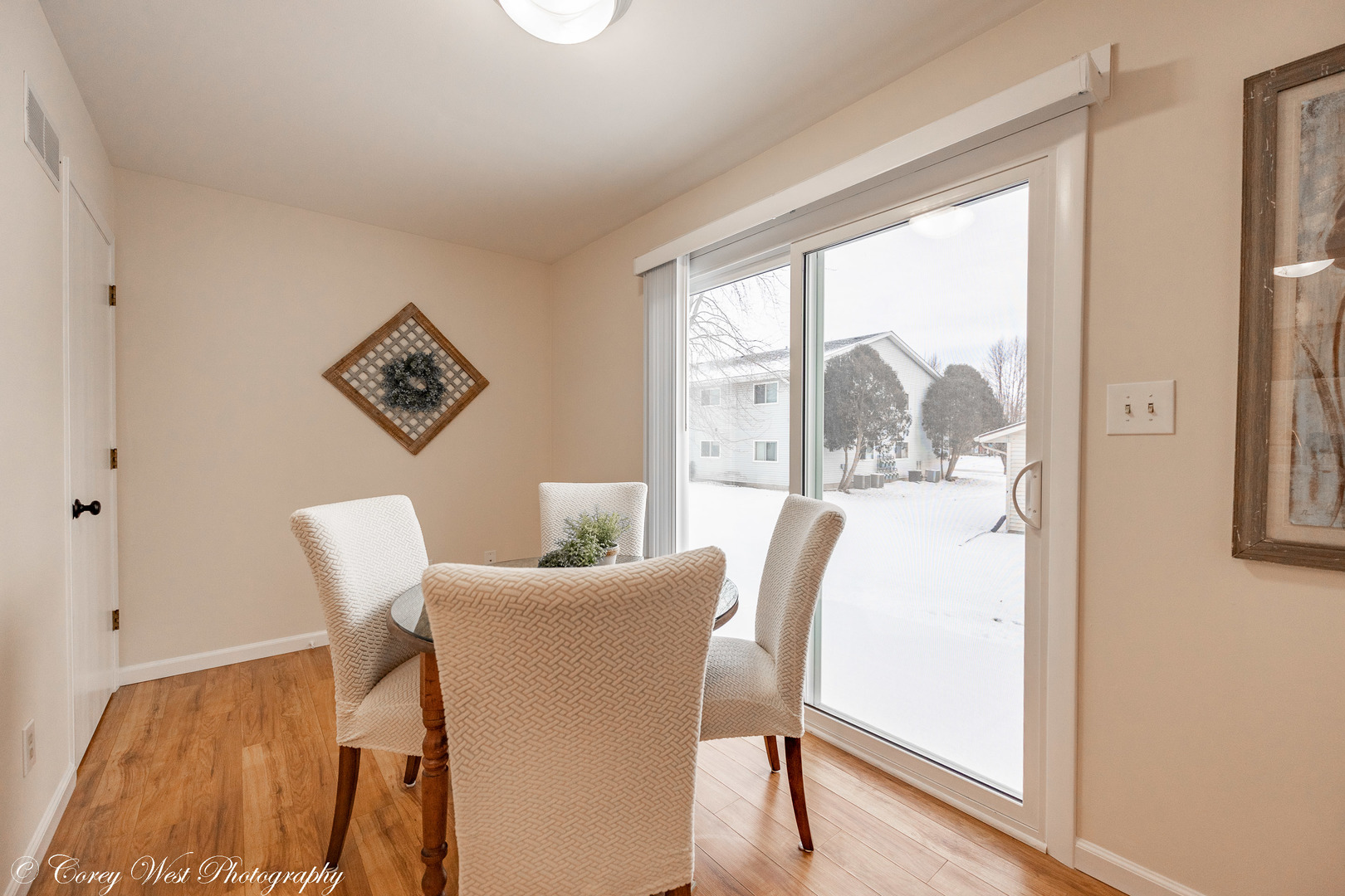 202 Chamberlain Drive DeKalb, IL 60115 - Photo 9 of 28 a view of a dining room with furniture window and wooden floor