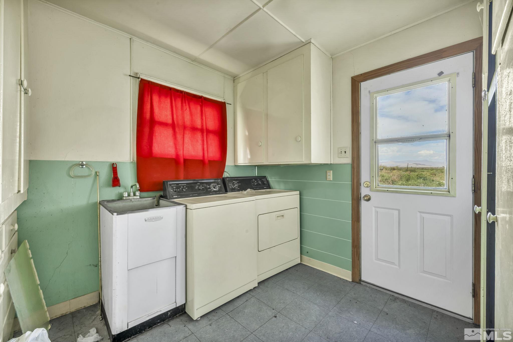 2905 Westfall Road Lovelock, NV 89419 - Photo 14 of 16 a room with cabinets a window and a wooden floor