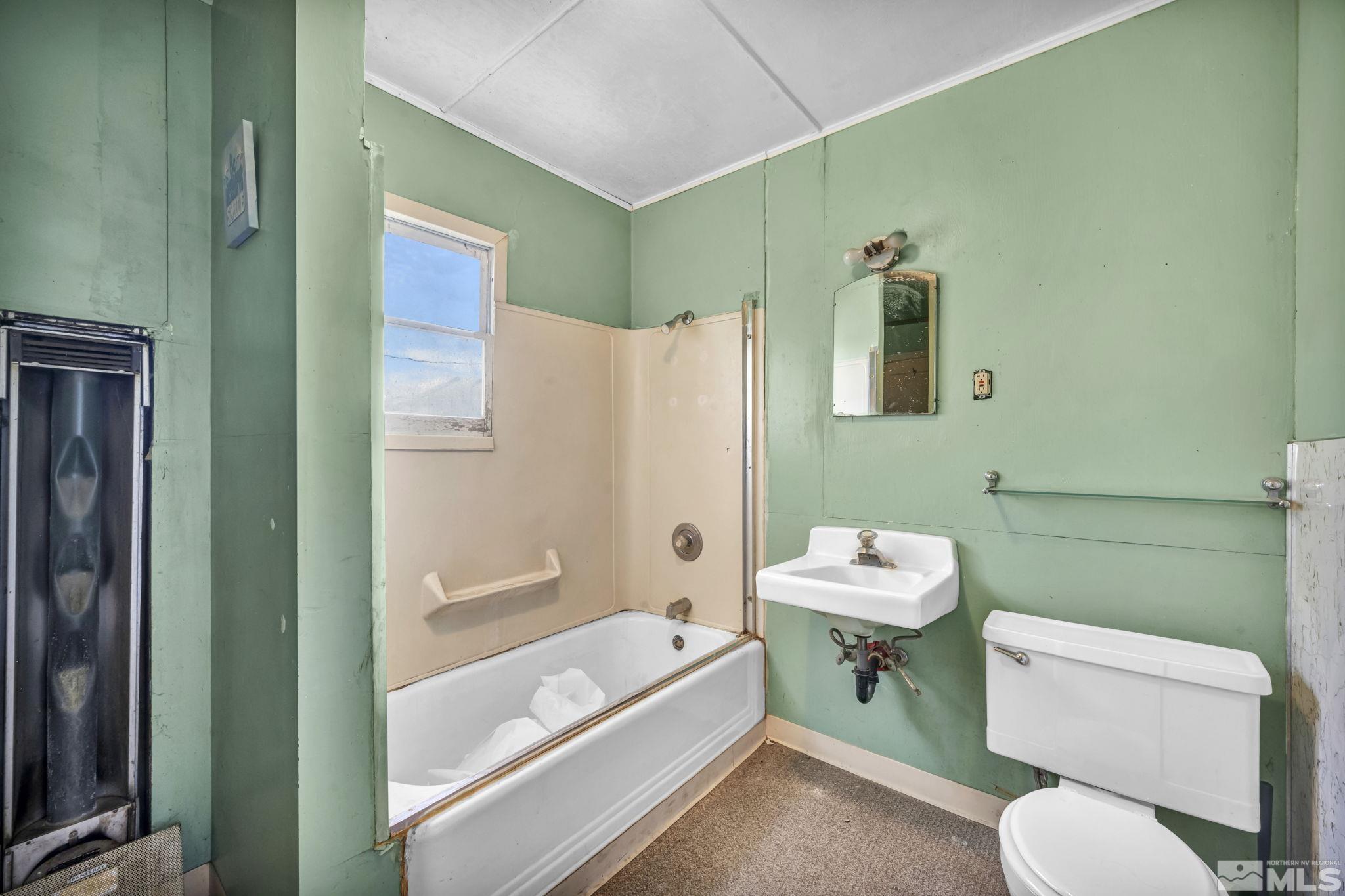 2905 Westfall Road Lovelock, NV 89419 - Photo 15 of 16 a bathroom with a sink toilet and shower