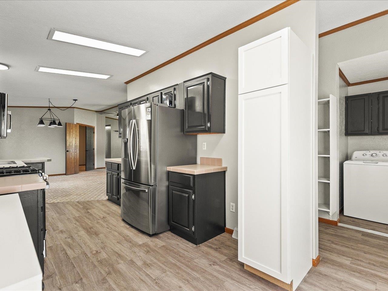 8686 Dutch Elm Court Roscoe, IL 61073 - Photo 15 of 33 a kitchen with stainless steel appliances a refrigerator and a stove top oven