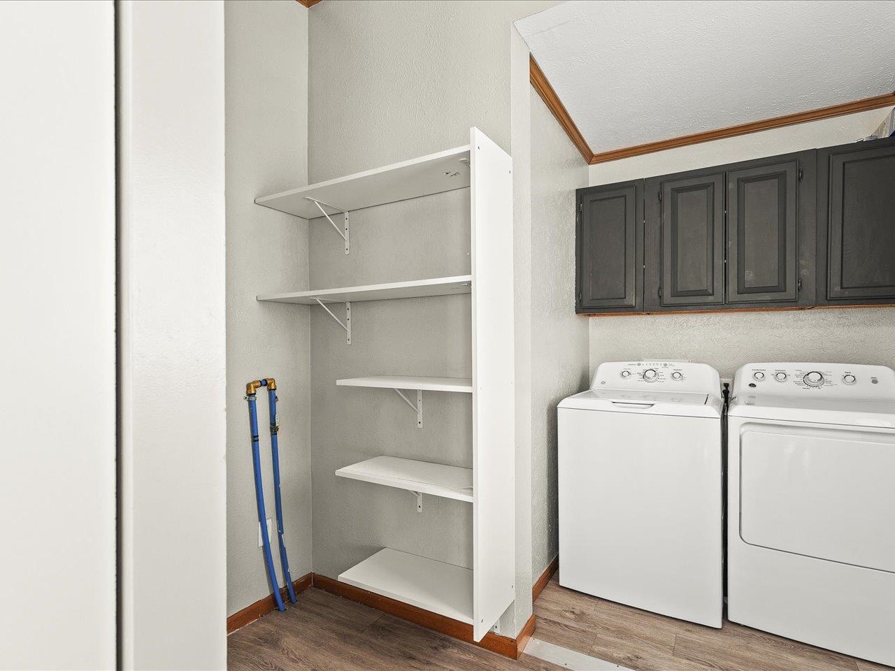 8686 Dutch Elm Court Roscoe, IL 61073 - Photo 17 of 33 a view of storage and utility room with washer and dryer
