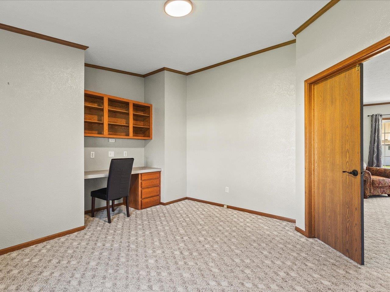 8686 Dutch Elm Court Roscoe, IL 61073 - Photo 24 of 33 a view of a livingroom with workspace and a window