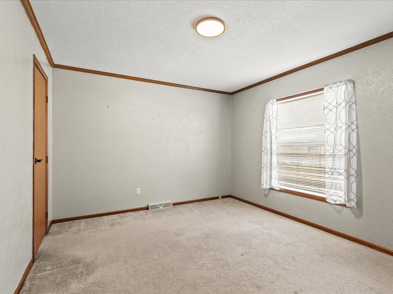 8686 Dutch Elm Court Roscoe, IL 61073 - Photo 28 of 33 an empty room with a empty space and windows