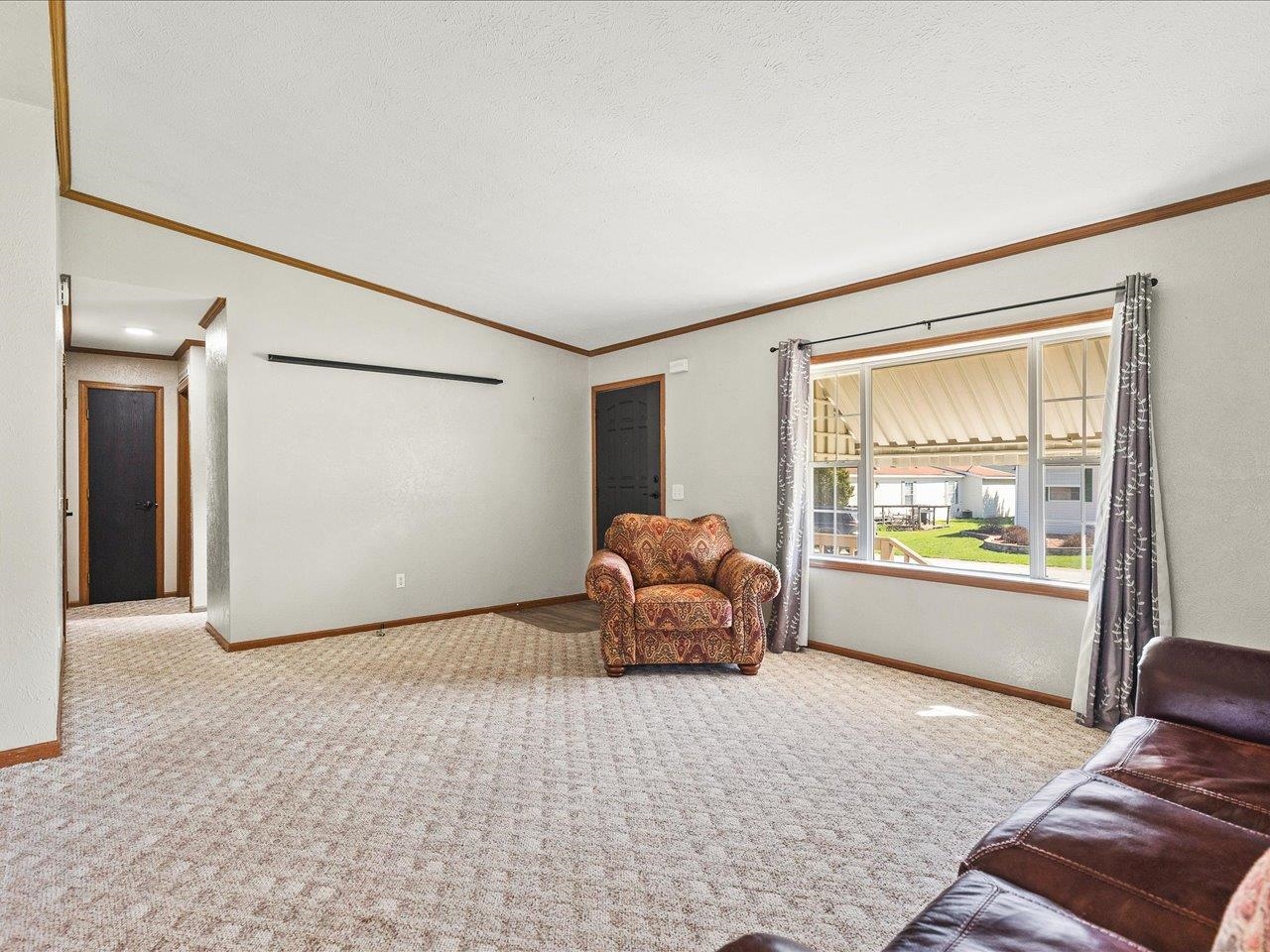8686 Dutch Elm Court Roscoe, IL 61073 - Photo 5 of 33 a living room with furniture and a window