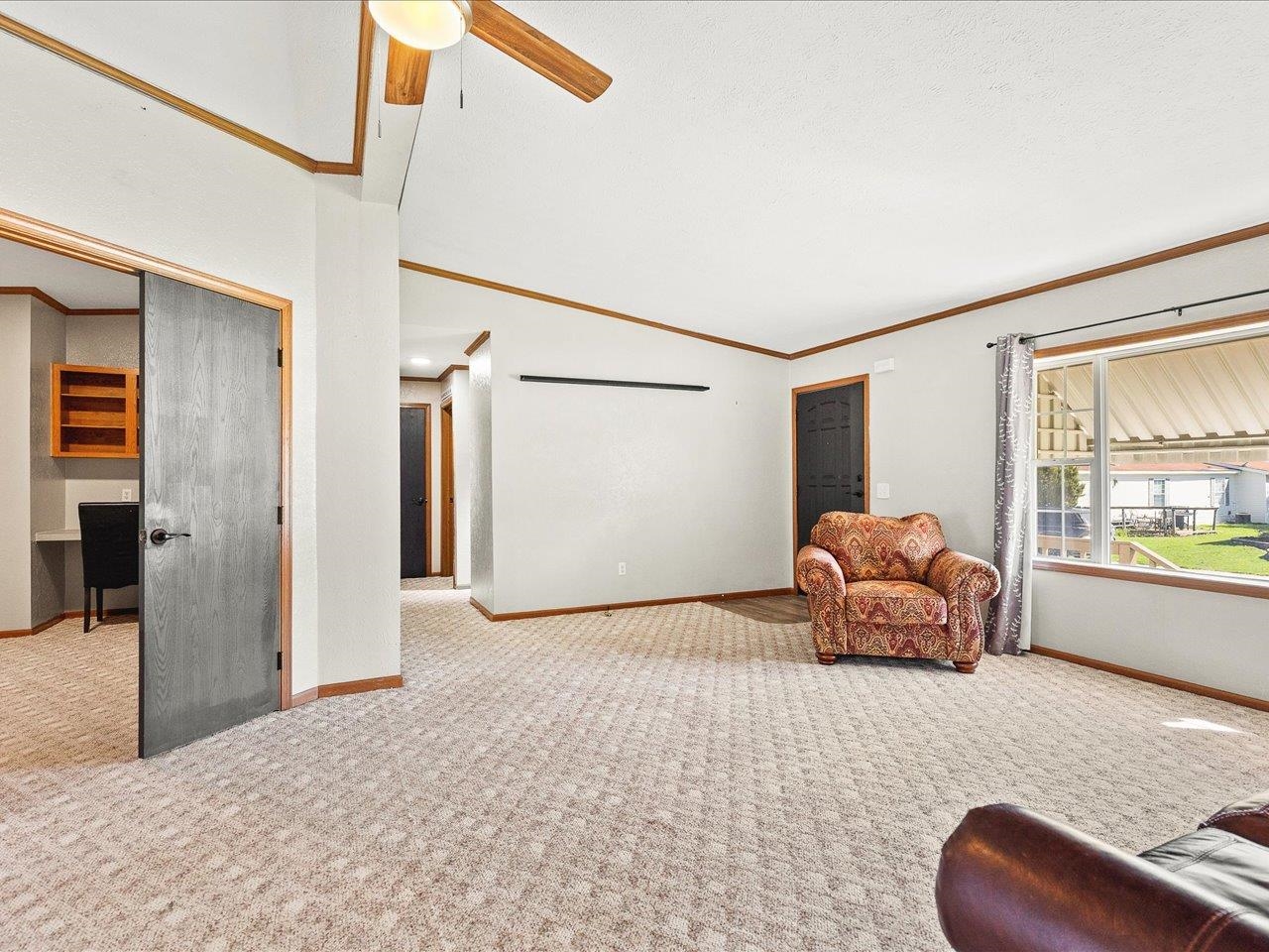 8686 Dutch Elm Court Roscoe, IL 61073 - Photo 6 of 33 a room with furniture and a window