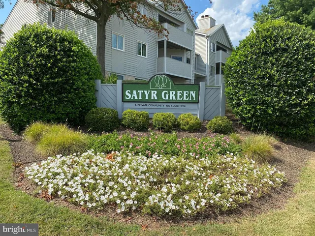 a view of a sign board with yard