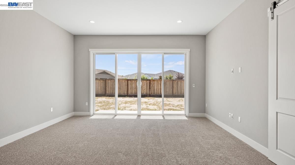 756 Conrad Street Manteca, CA 95336 - Photo 12 of 41 a view of an empty room with a window