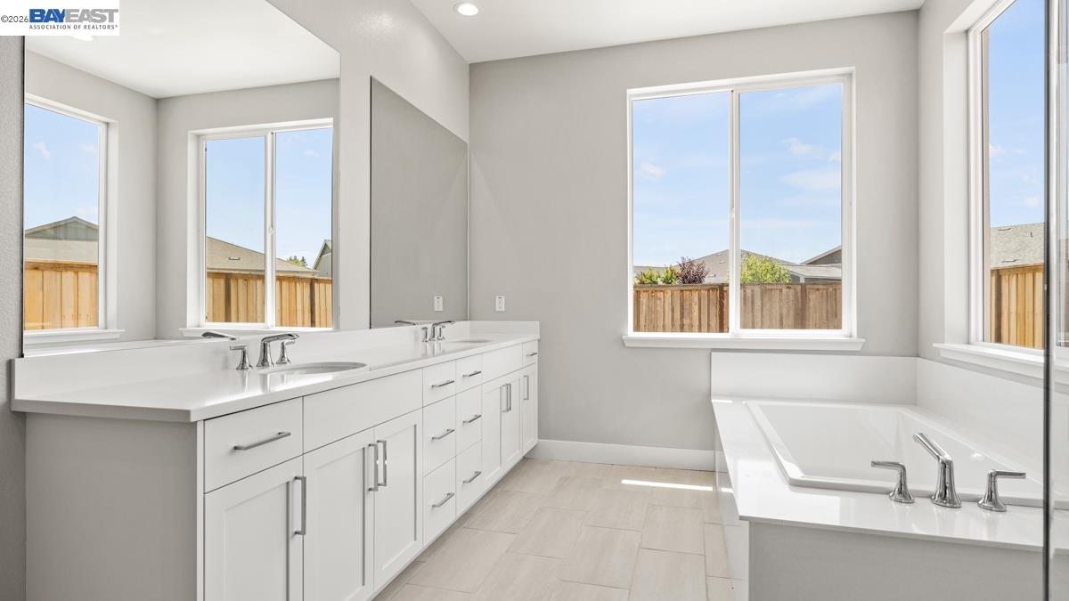 756 Conrad Street Manteca, CA 95336 - Photo 15 of 41 a bathroom with a sink and a window