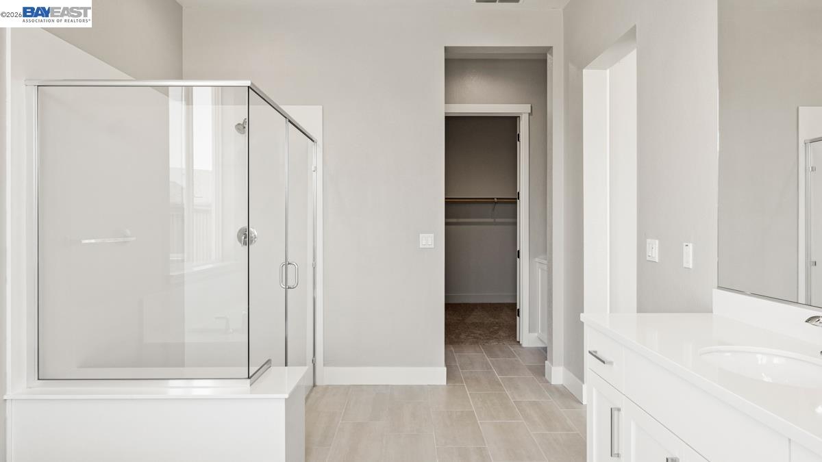 756 Conrad Street Manteca, CA 95336 - Photo 16 of 41 a bathroom with a shower and a tub