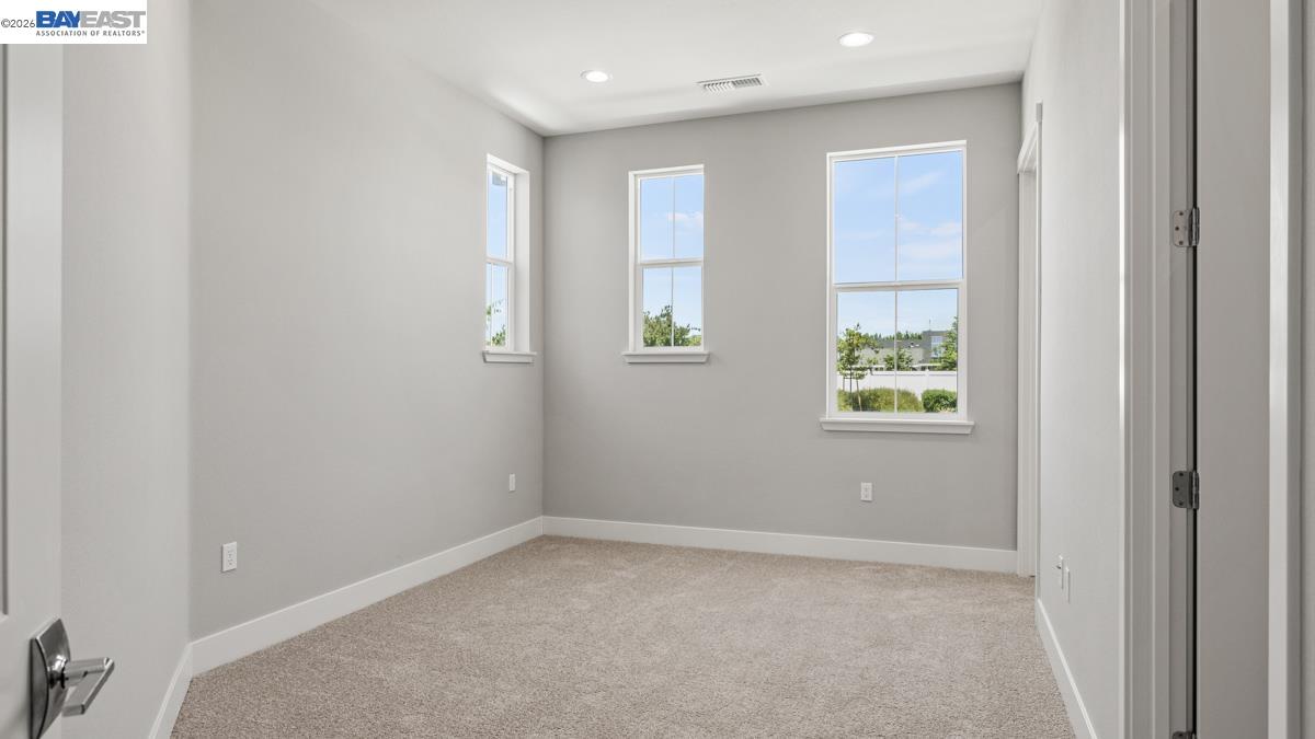 756 Conrad Street Manteca, CA 95336 - Photo 19 of 41 an empty room with windows