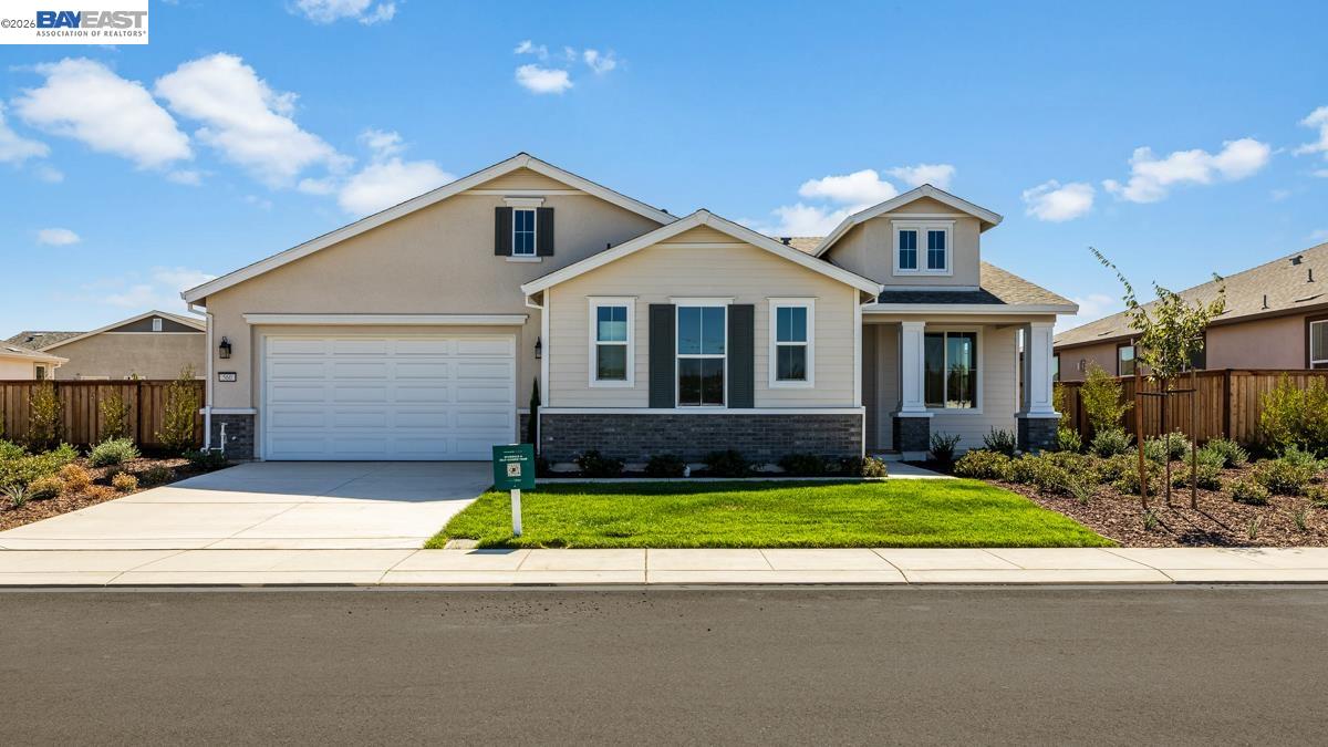 756 Conrad Street Manteca, CA 95336 - Photo 2 of 41 a front view of a house with a yard and garage