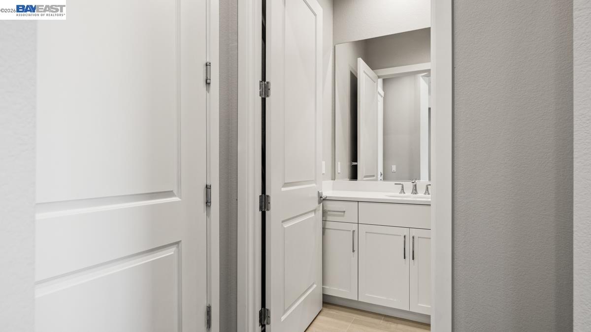 756 Conrad Street Manteca, CA 95336 - Photo 24 of 41 a bathroom with a sink and a mirror