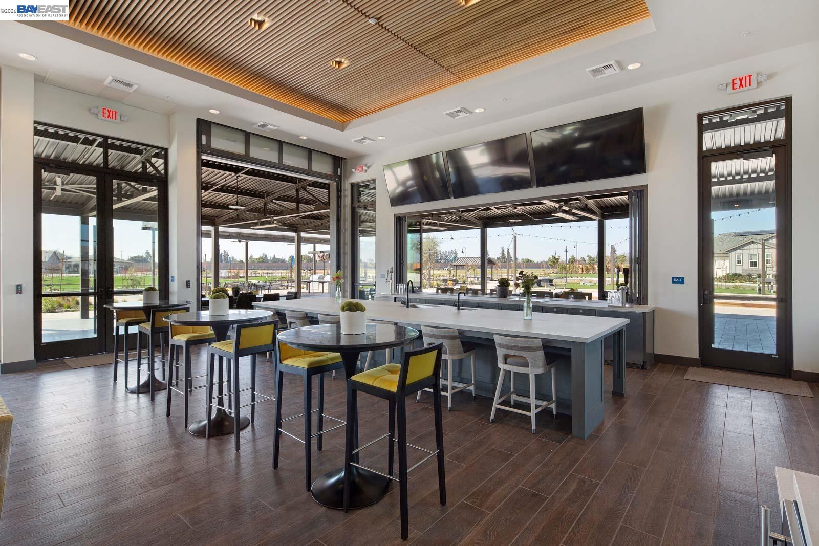 756 Conrad Street Manteca, CA 95336 - Photo 29 of 41 a view of a dining room with furniture window and wooden floor