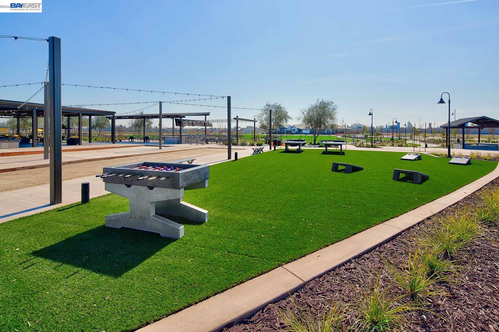 756 Conrad Street Manteca, CA 95336 - Photo 32 of 41 a view of a garden with lawn chairs