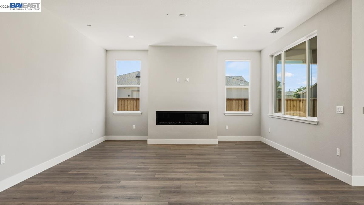 756 Conrad Street Manteca, CA 95336 - Photo 9 of 41 a view of livingroom with hardwood floor and hallway