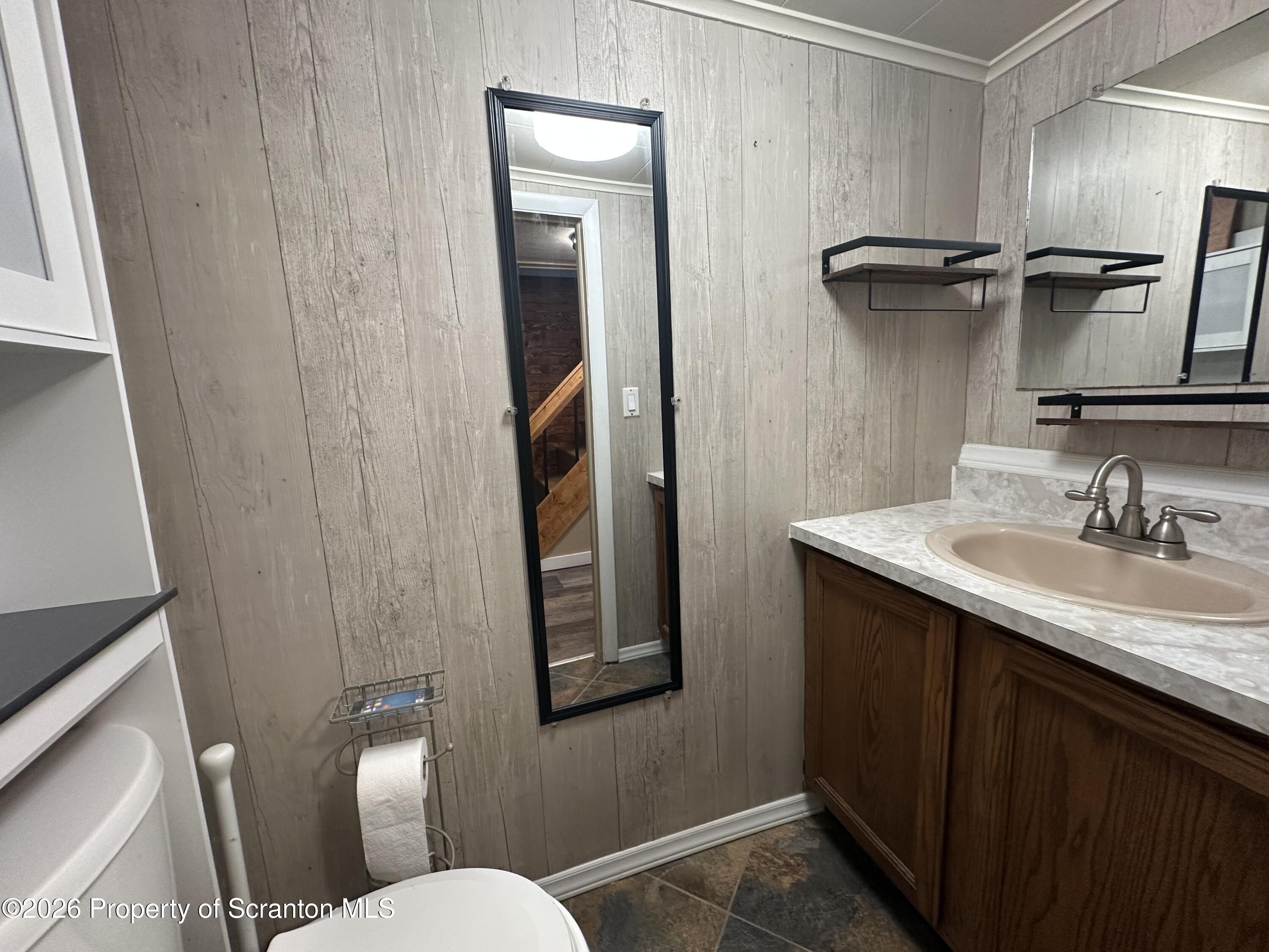 611 Chestnut Street Dunmore, PA 18512 - Photo 12 of 27 a bathroom with a granite countertop sink toilet and shower