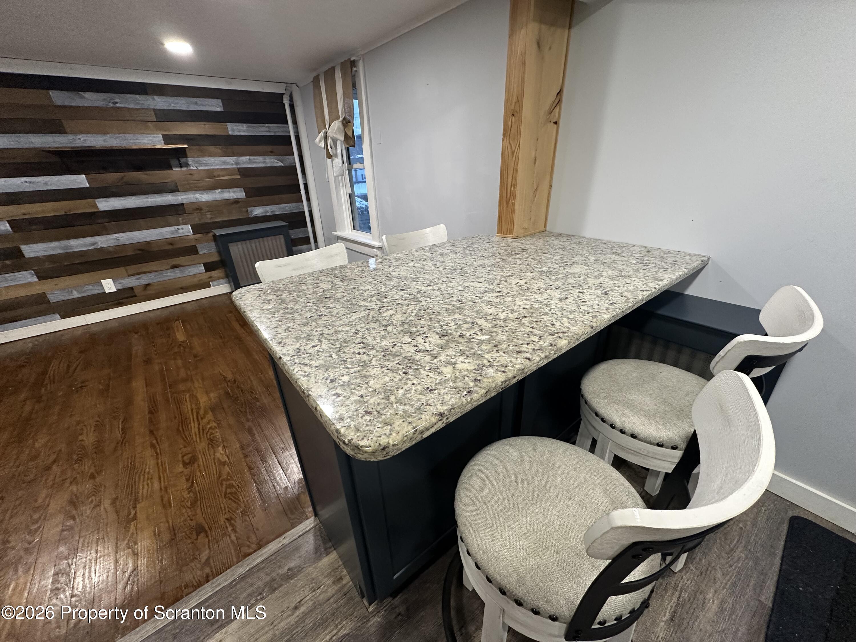 611 Chestnut Street Dunmore, PA 18512 - Photo 13 of 27 a outdoor kitchen with a table and chairs