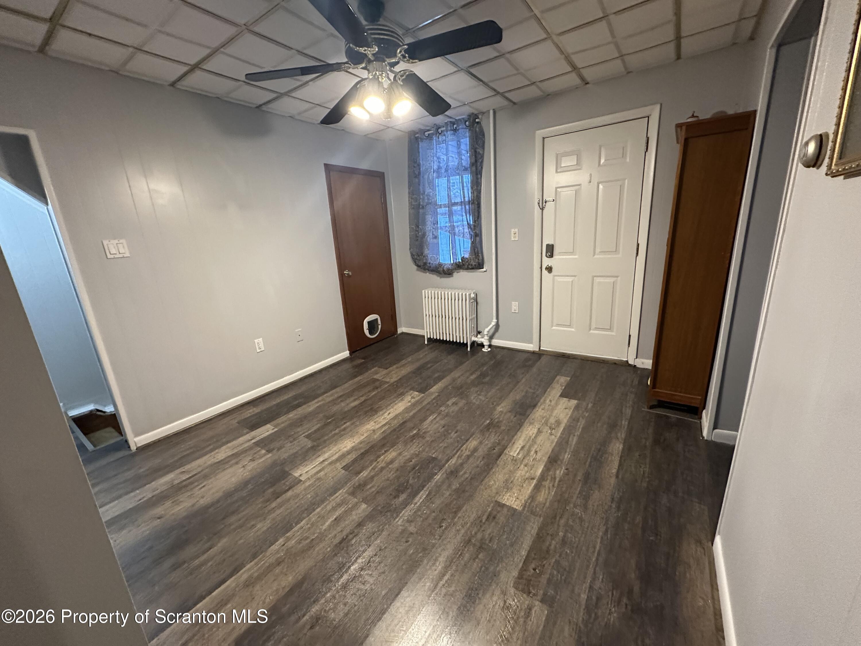 611 Chestnut Street Dunmore, PA 18512 - Photo 17 of 27 wooden floor in an empty room with a window