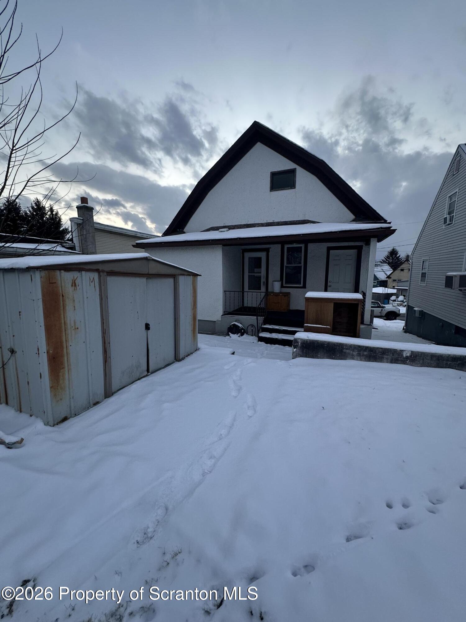 611 Chestnut Street Dunmore, PA 18512 - Photo 26 of 27 a front view of a house with a yard