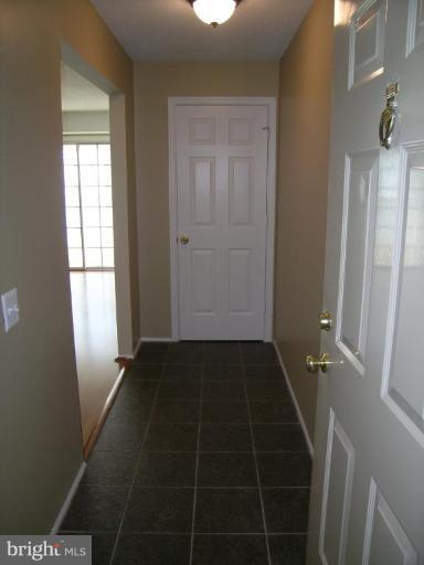 131 Fort Evans Road Southeast, Unit C Leesburg, VA 20175 - Photo 2 of 13 a view of an empty room