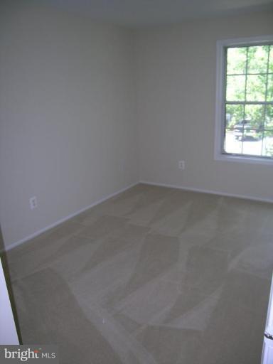 131 Fort Evans Road Southeast, Unit C Leesburg, VA 20175 - Photo 7 of 13 an empty room with a window
