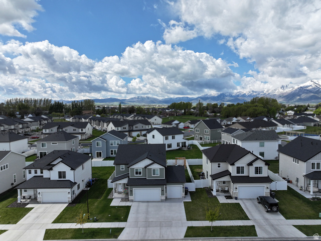 384 Ropelato Drive Nibley, UT 84321 - Photo 23 of 25 Aerial view of residential area with mountains