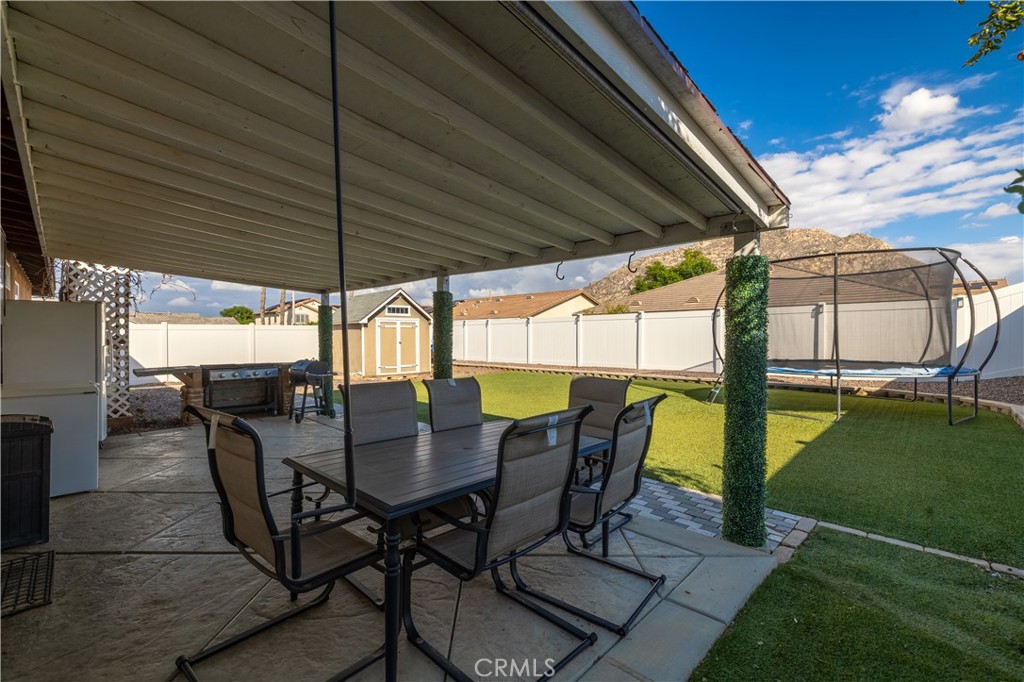 3079 Avalon Parkway Perris, CA 92571 - Photo 18 of 25 a view of an outdoor dining space with furniture and garden