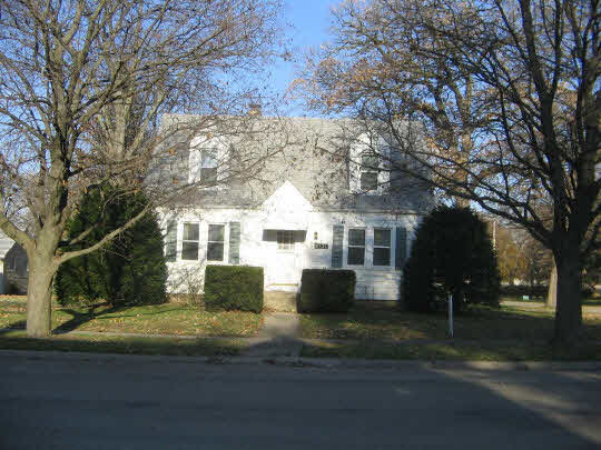 321 South 2nd Street Rochelle, IL 61068 - Photo 1 of 8 a front view of a house with a yard