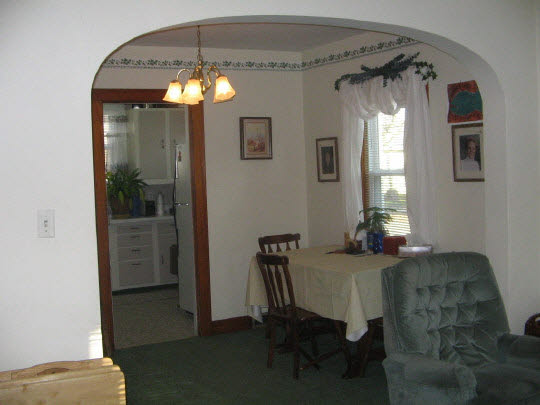 321 South 2nd Street Rochelle, IL 61068 - Photo 3 of 8 a view of a dining room with furniture and chandelier fan