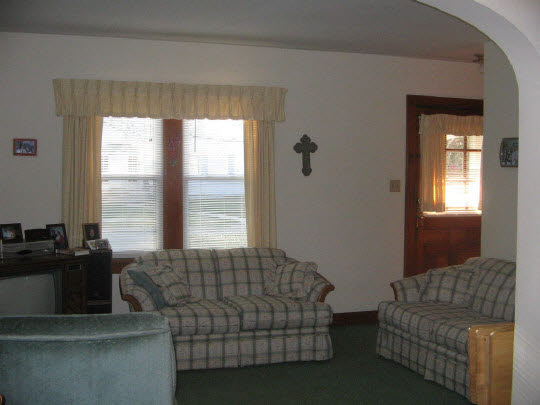321 South 2nd Street Rochelle, IL 61068 - Photo 5 of 8 a living room with furniture and a window
