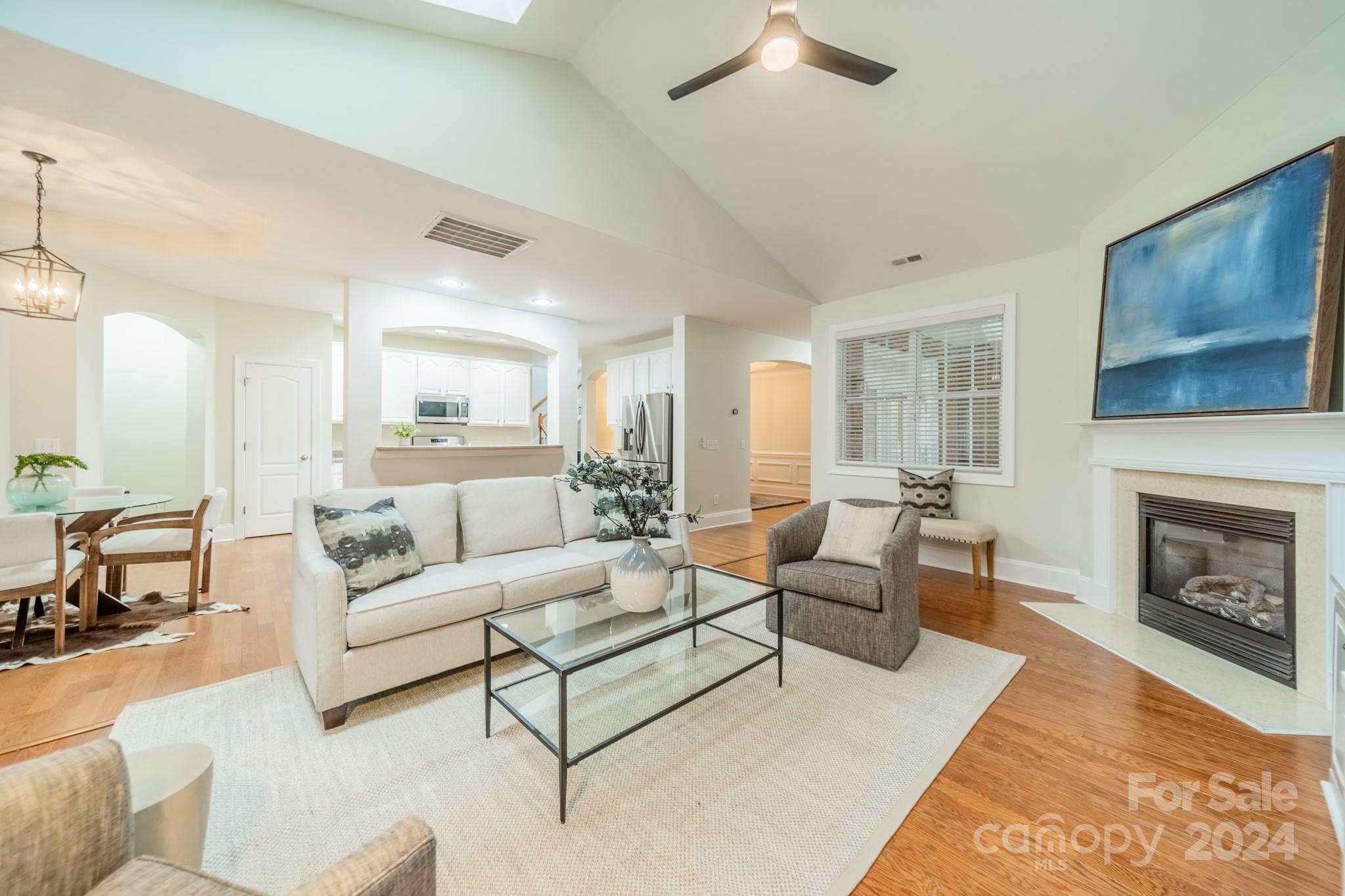 10806 Round Rock Road Charlotte, NC 28277 - Photo 13 of 41 a living room with furniture and a fireplace