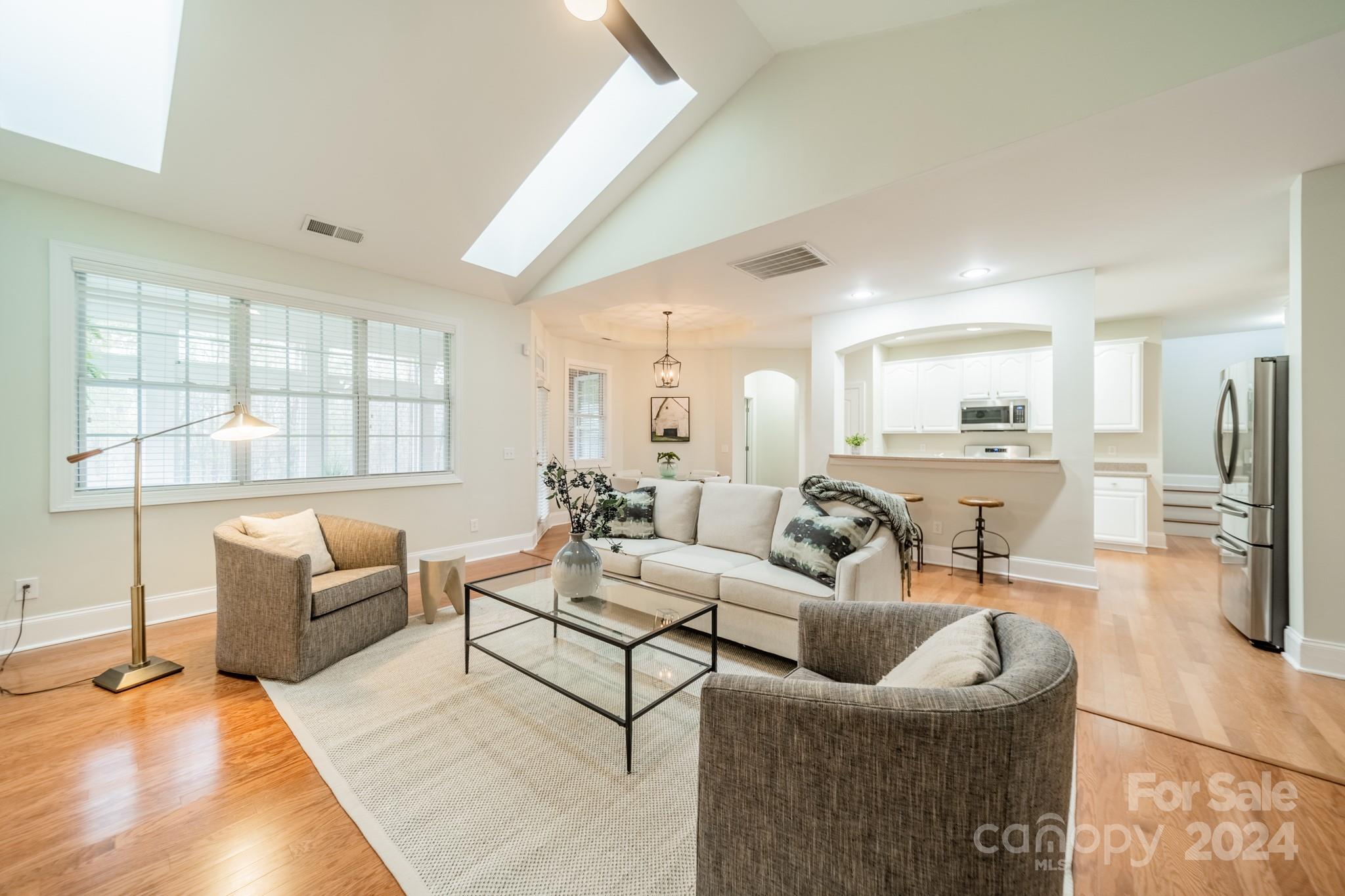 10806 Round Rock Road Charlotte, NC 28277 - Photo 14 of 41 a living room with furniture and a large window