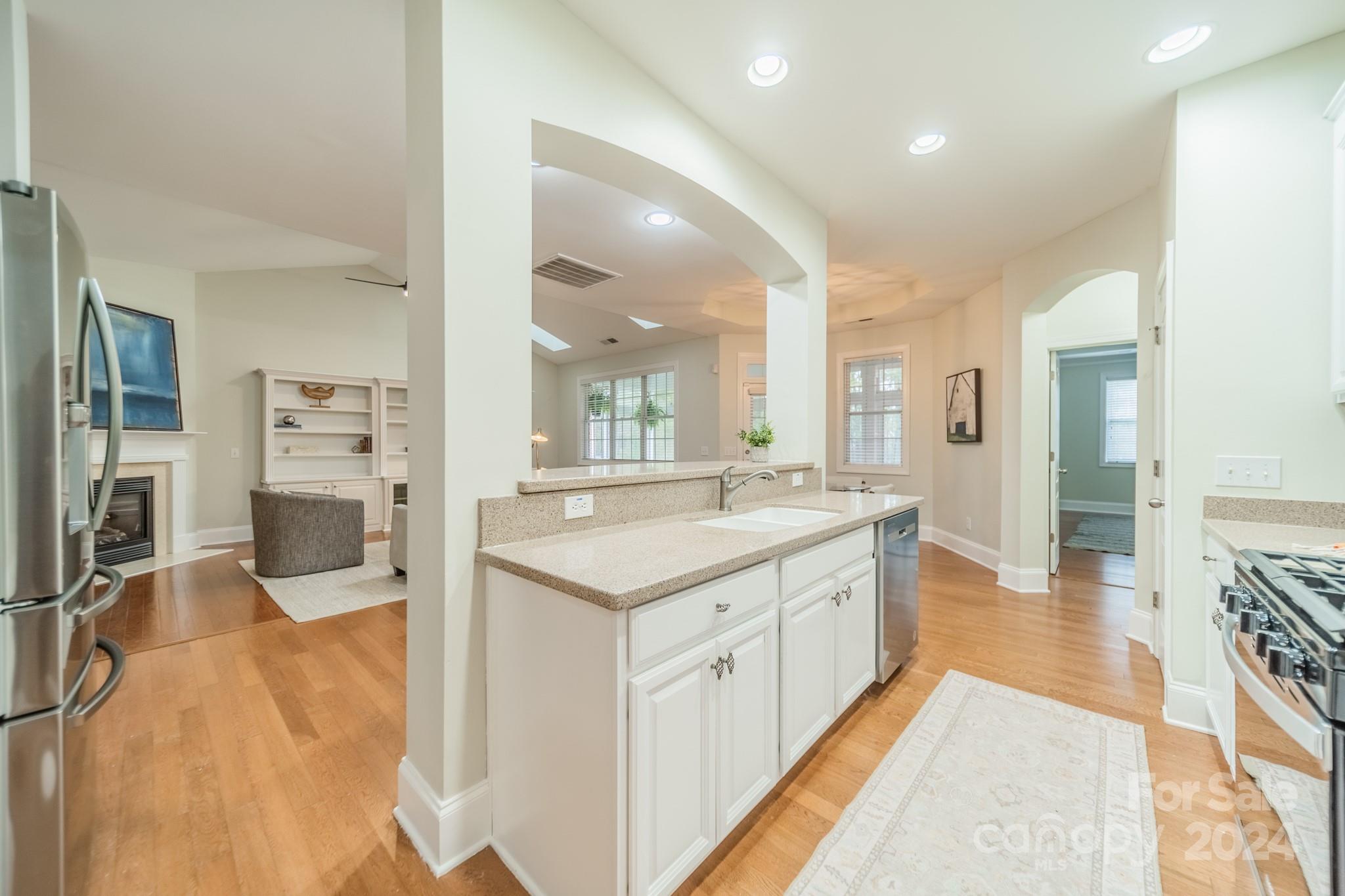 10806 Round Rock Road Charlotte, NC 28277 - Photo 19 of 41 a large kitchen with a large counter top appliances and cabinets