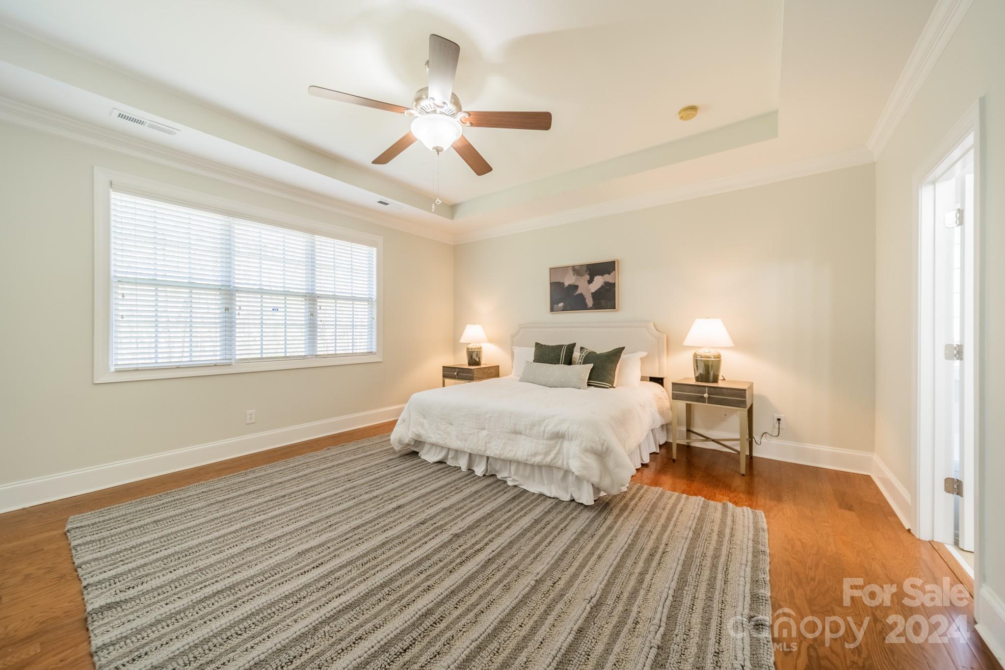 10806 Round Rock Road Charlotte, NC 28277 - Photo 21 of 41 a spacious bedroom with a bed and window