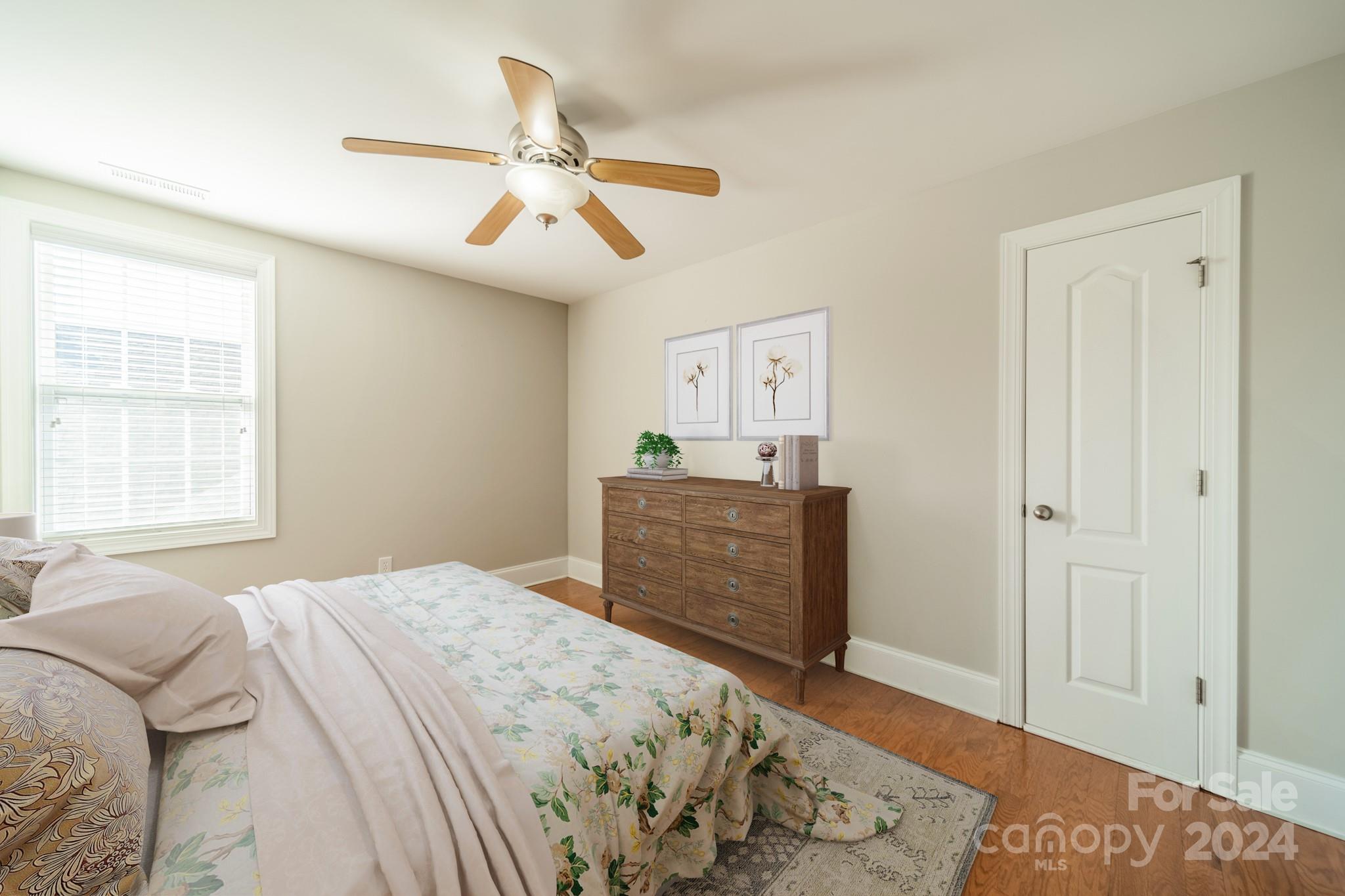 10806 Round Rock Road Charlotte, NC 28277 - Photo 32 of 41 a bedroom with a bed and a dresser