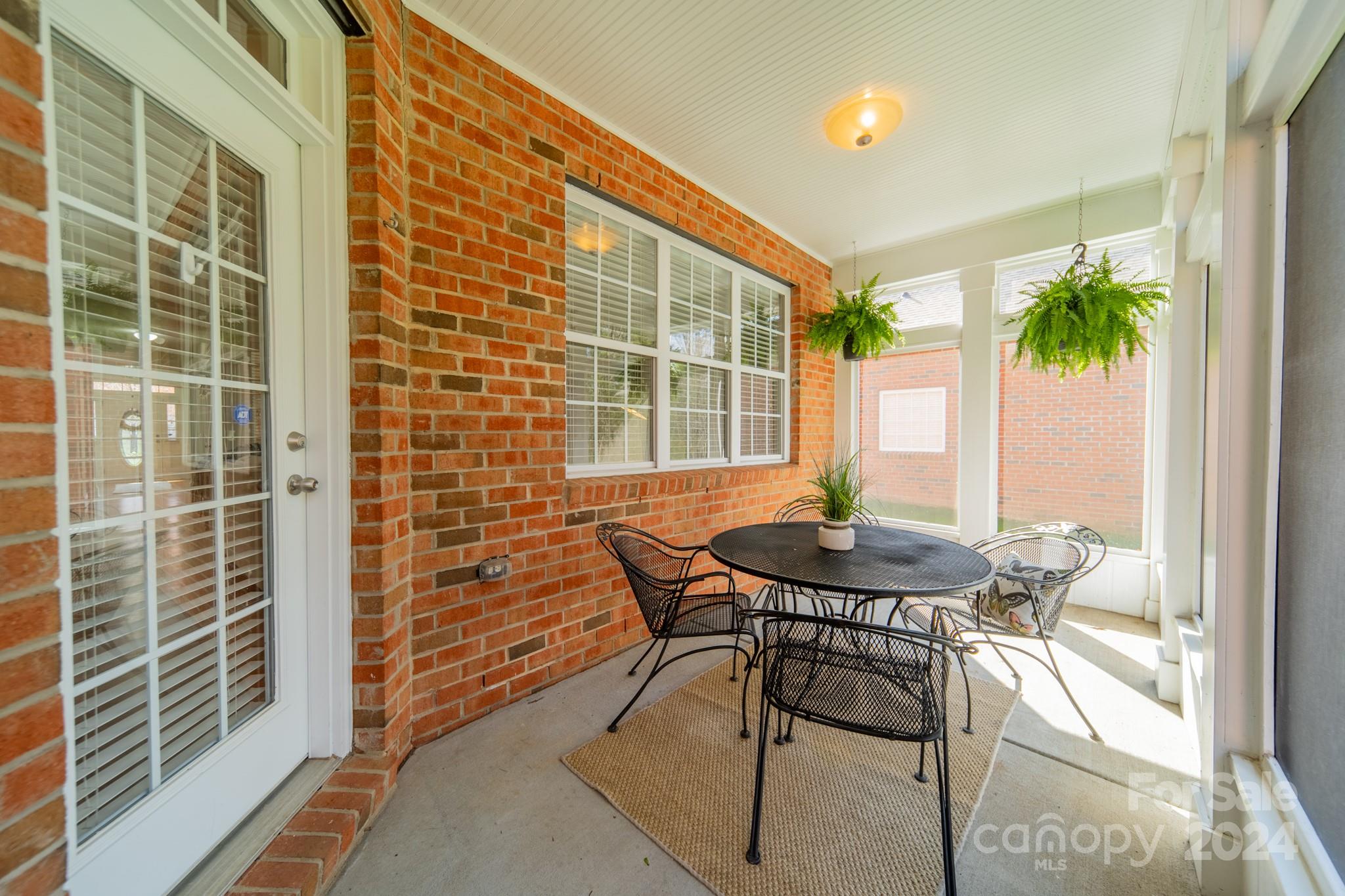 10806 Round Rock Road Charlotte, NC 28277 - Photo 36 of 41 a backyard of a house with table and chairs